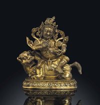 17TH CENTURY A GILT BRONZE FIGURE OF VAISHRAVANA