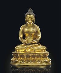 17TH CENTURY A GILT-BRONZE FIGURE OF SAKYAMUNI