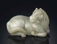 18TH CENTURY A LARGE PALE CELADON JADE MODEL OF A RECUMBENT HORSE