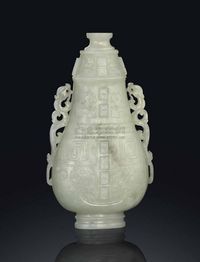 18TH CENTURY A PALE CELADON JADE ARCHAISTIC VASE AND COVER