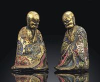 18TH CENTURY A PAIR OF CHAMPLEVé ENAMEL AND GILT-METAL FIGURES OF LUOHAN