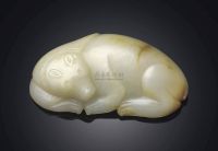 MING DYNASTY OR LATER A CREAMY CELADON JADE MODEL OF A BEAR