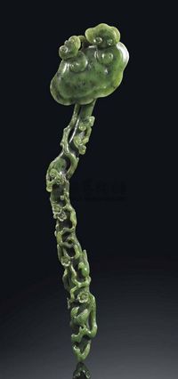 18TH/19TH CENTURY A CARVED SPINACH-GREEN JADE RUYI-SCEPTRE