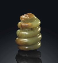 LATE MING DYNASTY，17TH CENTURY A SMALL MOTTLED YELLOWISH-GREEN JADE MODEL OF A SNAKE