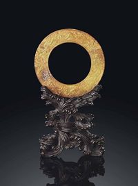 YUAN/MING DYNASTY，14TH CENTURY A RARE YELLOW JADE ARCHAISTIC DISC，HUAN