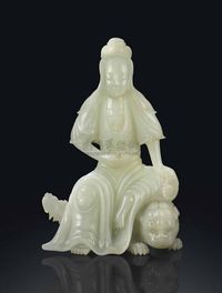 LATE QING DYNASTY，EARLY 20TH CENTURY A WHITE JADE FIGURE OF GUANYIN