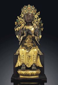 18TH CENTURY A SUPERB PARCEL-GILT BRONZE REPOUSSé FIGURE OF MAITREYA