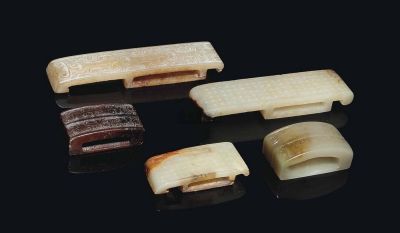 HAN DYNASTY (206BC-220AD) AND LATER FIVE JADE SWORD SLIDES