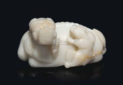 YUAN/MING DYNASTY (1279-1368) A WHITE JADE BUDDHIST LION GROUP