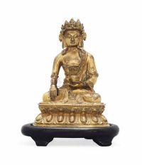 18TH/19TH CENTURY A SINO-TIBETAN GILT-BRONZE MODEL OF A BUDDHA