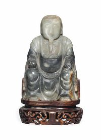 MING DYNASTY (1368-1644) A GREY JADE MODEL OF ZHEN WU