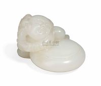 20TH CENTURY A WHITE JADE CARVING OF A BOY