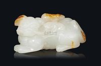 QIANLONG PERIOD (1736-95) A WHITE AND RUSSET JADE CARVING OF A MYTHICAL BEAST