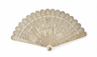19TH CENTURY A CARVED AND PIERCED IVORY BRISé FAN WITH A CENTRAL MONOGRAM AND FIGURES